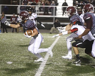        ROBERT K. YOSAY  | THE VINDICATOR..25 Mario Graziai  breaks through the line for a first down during first quarter action..Canfield vs Boardman @ Boardman .
