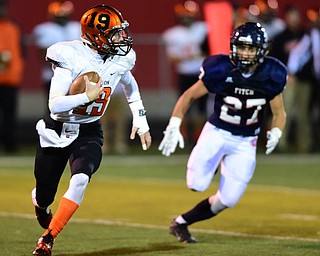 AUSTINTOWN, OHIO - OCTOBER 2, 2015: Lee Hurst II runs with the football while avoiding backside pressure from Zach Krohn #27 of Fitch during their game Friday night at Fitch Falcons Stadium. DAVID DERMER | THE VINDICATOR