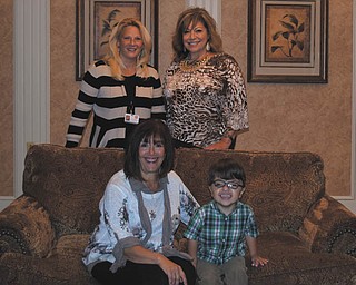 SPECIAL TO THE VINDICATOR
Promoting the 64th annual celebration dinner of Easter Seals and Youngstown Hearing and Speech are, seated, Celeste Lisko, left, board member and committee member, and Jackson Diaz, 2014-2105 child representative, and, in back, Jodi Harmon, left, director of marketing and public relations and event co-chairman, and Mary Ann Carano, board and committee member. Samie Winick, board member and event co-chairman, is not pictured.