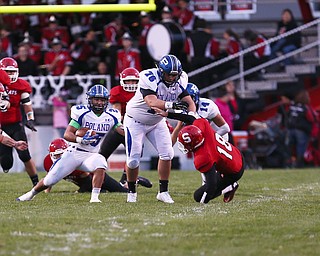 capps 1: First quarter  of the Poland Struthers football game  Kyle McCree (78) offensive tackle leads the blocking by  blocking Struthers defensive back AJ Musolino (18) defensive back as Anthony Audi gains yardage in the first quarter.