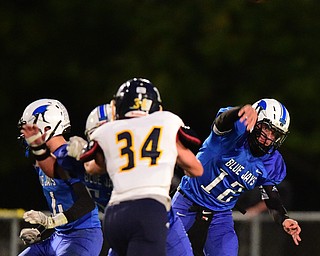 NORTH JACkSON, OHIO - OCTOBER 2, 2015: Mike Assign #12 of Jackson Milton throws a pass during the 1st half of their game at Jackson Milton Stadium Friday night. DAVID DERMER | THE VINDICATOR