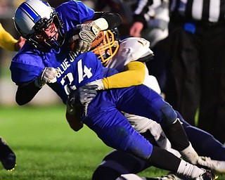 NORTH JACkSON, OHIO - OCTOBER 2, 2015: Joseph Burnside #24 of Jackson Milton fall across the goal line to score a touchdown after Dylan Portolese #13 of McDonald failed to bring him down during the 1st half of their game at Jackson Milton Stadium Friday night. DAVID DERMER | THE VINDICATOR