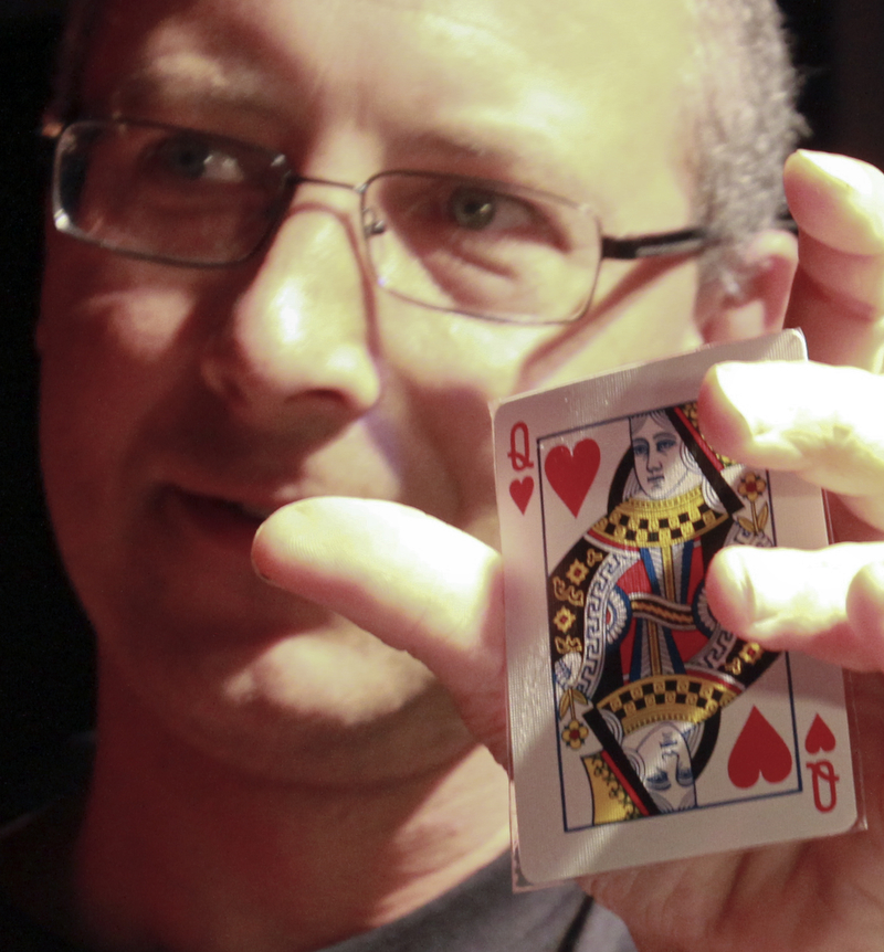 William D Lewis The Vindicator Doug Duganne, Barry Dyngle Mgr holds queen of hearts card that won 1.8 million for a warren woman during Queen of Hearts drawing atBarry Dyngles 10-4-15.