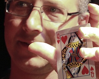 William D Lewis The Vindicator Doug Duganne, Barry Dyngle Mgr holds queen of hearts card that won 1.8 million for a warren woman during Queen of Hearts drawing atBarry Dyngles 10-4-15.
