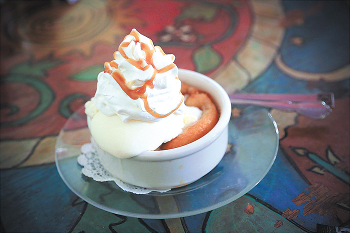 The peach cobbler at The Bent Fork is topped with ice cream and whipped cream to make the perfect end to a meal.