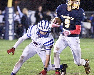 William D Lewis the Vindicator McDonald's Jake Re4kard(9) eludes Logan Matas (5) of Western Reserve during 1rst half action in McDonald 10-9-15.