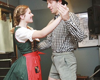 William D Lewis the Vindicator Auggie Heschmeyer and his sister D'Ella Heschmeyer of Liberty dance to German music at Kravitz Deli in Liberty Friday as part of Oktoberfest event.