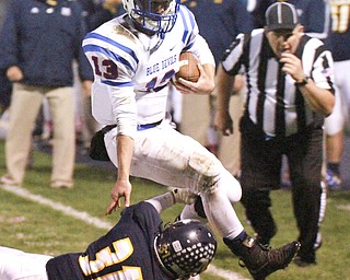 William D Lewis the Vindicator WR's Wyatt Larimer(13) is knocked out of bounds by McDonald's Alex Cintron(31) during 1rst half action in McDonald 10-9-15.