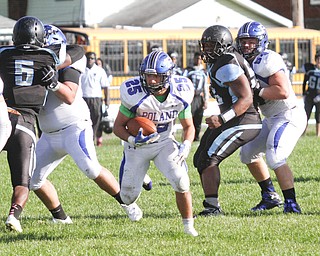        ROBERT K. YOSAY  | THE VINDICATOR..Poland at East -..Polands #25  Anthony Audi  breaks out of the back field and runs for a TD run during 4th quarter action sewing up the victory for poland