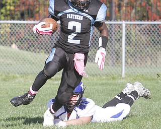        ROBERT K. YOSAY  | THE VINDICATOR..Poland at East -East #2  Mike Lawerance  takes off upfield during 4th quarter action as he espcapes #85 Nick Miller
