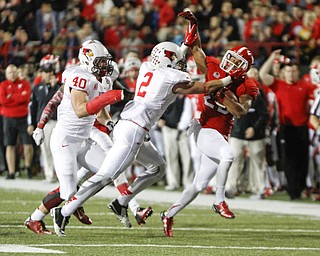        ROBERT K. YOSAY  | THE VINDICATOR..YSU #20 Jody Webb gets in a shoving match with Redbirds #2 Alec Kocour - as #40 watches- Alex Donnelly - Alec stopped the touchdown run by shoving him out of bounds