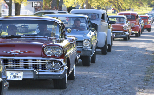 Wiliam d Lewis the vindicator Dennis Hake is all smiles as he and his wife Dolly watch a parade of classic cars passing their Howland home 10-11-15. Hake , a car enthusiast is suffering form serious illnes and his wish was to see a car show.