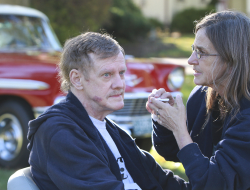 Wiliam d Lewis the vindicator Dennis Hake is all smiles as he and his wife Dolly watch a parade of classic cars passing their Howland home 10-11-15. Hake , a car enthusiast is suffering form serious illnes and his wish was to see a car show.