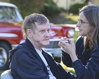 Wiliam d Lewis the vindicator Dennis Hake is all smiles as he and his wife Dolly watch a parade of classic cars passing their Howland home 10-11-15. Hake , a car enthusiast is suffering form serious illnes and his wish was to see a car show.