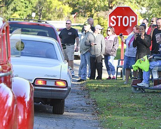 Wiliam d Lewis the vindicator Dennis Hake is all smiles as he and his wife Dolly and a large group of onlookers watch a parade of classic cars passing their Howland home 10-11-15. Hake , a car enthusiast is suffering form serious illnes and his wish was to see a car show.