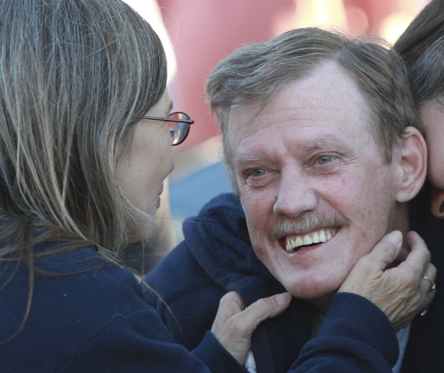 Wiliam d Lewis the vindicator Dennis Hake is all smiles as he shares a moment withhis with Dolly as a parade of classic car passes their Howland homes 10-11-15. Hake , a car enthusiast is suffering form serious illnes and his wish was to see a car show.