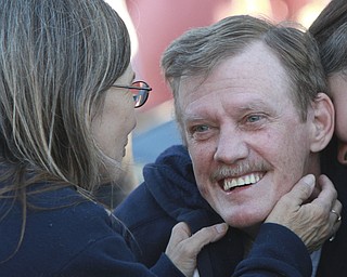 Wiliam d Lewis the vindicator Dennis Hake is all smiles as he shares a moment withhis with Dolly as a parade of classic car passes their Howland homes 10-11-15. Hake , a car enthusiast is suffering form serious illnes and his wish was to see a car show.