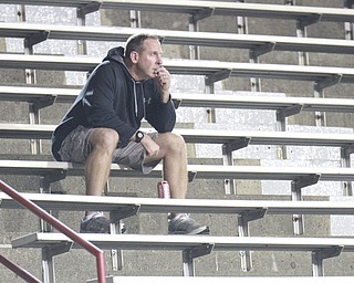 William D. Lewis The Vindicator  YSU coacj Bo Pellini watches Mooney Harding game 10-15-15 at Stambaugh