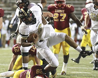 William D. Lewis The Vindicator  HArding's ILynn Williams(2) is stopped by Mooney's C. Gruber(28) during 1rst half action 10-15-15 at Stambaugh.