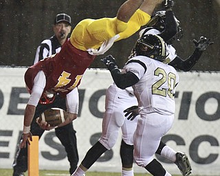 William D. Lewis The Vindicator Mooney's(14) dives into the endzone for a 2nd QTR TD past  Harding defenders Jalen Hooks(22) and Thad McCullough(20) 10-15-15 at Stambaugh.