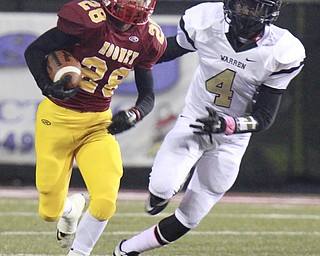 William D. Lewis The Vindicator Mooney's C. Gruber(28) eludes HArdings Juwan Pringle(4) during 1rst half action 10-15-15 at Stambaugh