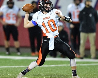 NILES, OHIO - OCTOBER 15, 2015: Jake Lester #10 oh Howland loads up to throw a pass during the 1st half of a game at Niles High School on Thursday night. DAVID DERMER | THE VINDICATOR