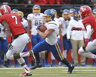 William D.Lewis The Vindicator Kyle Paris(32) of SDS  runs for 1rst half yardage during 10-7-15 game with YSU. Persuing are YSU's Kenneth Durden(7) and LeRoy Alexander(3).