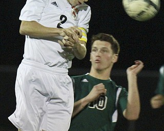 William D. Lewis The Vindicator Howland's Kyle Fenton(2) heads the ball as Nordonia's Jaritt Louthan10) defends during 10-21-15 action at Howland.