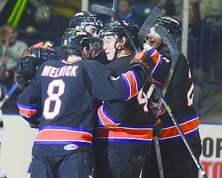 Katie Rickman | The Vindicator.Phantom's players celebrate after the first point of the game against Fargo Force was scored by Maxim Letunov (#7) on Feb 28, 2015.
