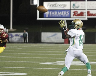        ROBERT K. YOSAY  | THE VINDICATOR..Ursulines #14  Dakota Hobbs pulls in a pass and goes for 20 plus yards as Mooneys #21 Justin Lanzo looks on..Ursuline vs Mooney at Stambaugh Stadium...-30-