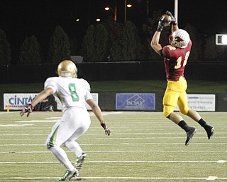        ROBERT K. YOSAY  | THE VINDICATOR..Mooneys #12  Andrew Armstrong picks off a 3rd quarter pass away from Ursulines #8 Deion Edwards..Ursuline vs Mooney at Stambaugh Stadium...-30-