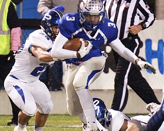 William D Lewis The Vindicator  Hubbard's Tyreq Moore(3) eludes Poland's anthony audi(25) and Pad O'Shaughnessy(44) during 1rst half action 10-23-15 at Hubbard.