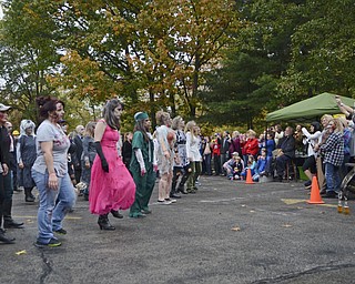 Katie Rickman | The Vindicator.Dancers participate in a choreographed dance to Thriller by Michael Jackson during the fifth annual Zombie Crawl at the B&O in Youngstown on Saturday evening. At about 6:45 the "zombies" walked over the Spring Commons Bridge to walk down Federal Street.