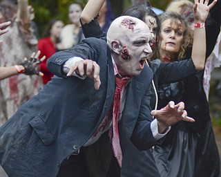 Katie Rickman | The Vindicator.Randy Arnold of Youngstown dances along to a choreographed dance to Thriller by Michael Jackson during the fifth annual Zombie Crawl at the B&O in Youngstown on Saturday evening. Arnold said that it was his first year participating in the event.
