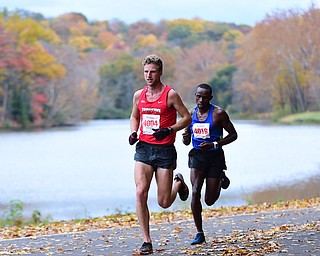 YOUNGSTOWN, OHIO - OCTOBER 25, 2015: Eric Rupe sprints infant of Philip Lagat as they both pass in front of Lake Glacier inside Mill Creek Park during the Peace Race Sunday morning. DAVID DERMER | THE VINDICATOR