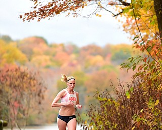 YOUNGSTOWN, OHIO - OCTOBER 25, 2015: Samantha Malmfeldt jogs along West Glacier Drive inside Mill Creek Park during the Peace Race Sunday morning. DAVID DERMER | THE VINDICATOR