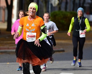 YOUNGSTOWN, OHIO - OCTOBER 25, 2015: Christina Toth jogs to the finish line at the end of West Federal Street during the Peace Race Sunday morning. DAVID DERMER | THE VINDICATOR