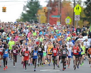 YOUNGSTOWN, OHIO - OCTOBER 25, 2015: Runners run down Kirk Road at the start of the Peace Race Sunday morning. DAVID DERMER | THE VINDICATOR