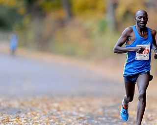 YOUNGSTOWN, OHIO - OCTOBER 25, 2015: Julius Koskel jogs along West Glacier Drive inside Mill Creek Park during the Peace Race Sunday morning. DAVID DERMER | THE VINDICATOR