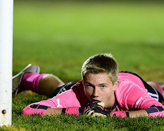 NORTH LIMA, OHIO - OCTOBER 27, 2015: Scott Murray #00 of Crestview lays on the ground beside the goal moments after South Range scored the first goal of the game during the 1st half of a game Tuesday night at the old South Range High School. DAVID DERMER | THE VINDICATOR