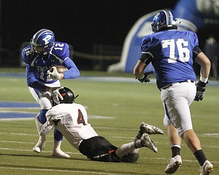       .         ROBERT  K. YOSAY | THE VINDICATOR..Canields #4 Paul Breinz  pulls down Polands #12 Tyler Smith in the backfield for a loss during first quarter action..Canfield at Poland Canfied wins 7-6..-30-