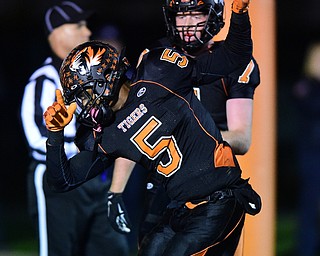 HOWLAND, OHIO - OCTOBER 30, 2015: Tyriq Ellis #5 of Howland celebrates after scoring a touchdown during the 1st half of a game Friday night at Howland High School. DAVID DERMER | THE VINDICATOR..Howland's John Andamasaris #7 pictured.