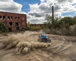 At first glance, it could be a scene from a "Mad Max" video..But the video released Tuesday by Mad Media - showing professional off-road stunt driver R.J. Anderson tearing through a bleak, post-apocalyptic landscape - was shot in Youngstown, Warren and other Mahoning Valley locations.