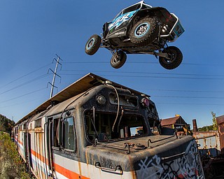 At first glance, it could be a scene from a "Mad Max" video..But the video released Tuesday by Mad Media - showing professional off-road stunt driver R.J. Anderson tearing through a bleak, post-apocalyptic landscape - was shot in Youngstown, Warren and other Mahoning Valley locations.
