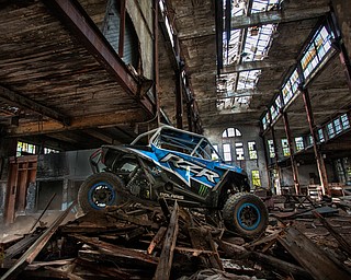 At first glance, it could be a scene from a "Mad Max" video..But the video released Tuesday by Mad Media - showing professional off-road stunt driver R.J. Anderson tearing through a bleak, post-apocalyptic landscape - was shot in Youngstown, Warren and other Mahoning Valley locations.
