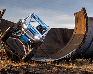 At first glance, it could be a scene from a "Mad Max" video..But the video released Tuesday by Mad Media - showing professional off-road stunt driver R.J. Anderson tearing through a bleak, post-apocalyptic landscape - was shot in Youngstown, Warren and other Mahoning Valley locations.