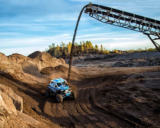 At first glance, it could be a scene from a "Mad Max" video..But the video released Tuesday by Mad Media - showing professional off-road stunt driver R.J. Anderson tearing through a bleak, post-apocalyptic landscape - was shot in Youngstown, Warren and other Mahoning Valley locations.