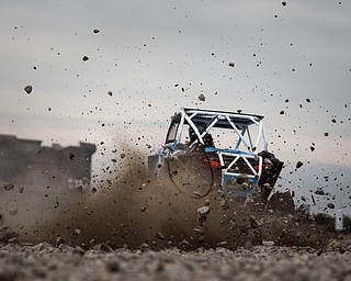 At first glance, it could be a scene from a "Mad Max" video..But the video released Tuesday by Mad Media - showing professional off-road stunt driver R.J. Anderson tearing through a bleak, post-apocalyptic landscape - was shot in Youngstown, Warren and other Mahoning Valley locations.