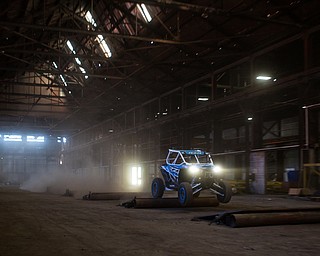 At first glance, it could be a scene from a "Mad Max" video..But the video released Tuesday by Mad Media - showing professional off-road stunt driver R.J. Anderson tearing through a bleak, post-apocalyptic landscape - was shot in Youngstown, Warren and other Mahoning Valley locations.