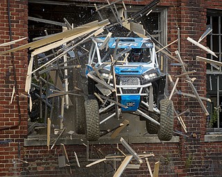 At first glance, it could be a scene from a "Mad Max" video..But the video released Tuesday by Mad Media - showing professional off-road stunt driver R.J. Anderson tearing through a bleak, post-apocalyptic landscape - was shot in Youngstown, Warren and other Mahoning Valley locations.